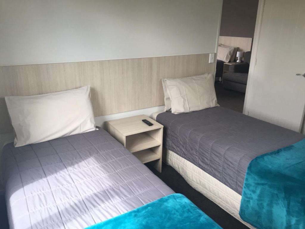 Postel nebo postele na pokoji v ubytování Rolleston Highway Motel