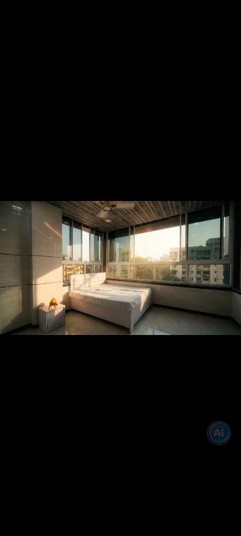 a large room with a bed in a building at Hotel kingspalace and Dormitory in Vapi
