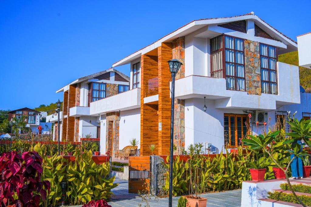 a house with a garden in front of it at Goya Hills 3BHK - Private Villa Udaipur in Udaipur