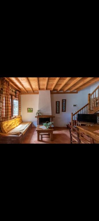 a large room with a couch and a table at Alexis new villas in Chrysi Ammoudia
