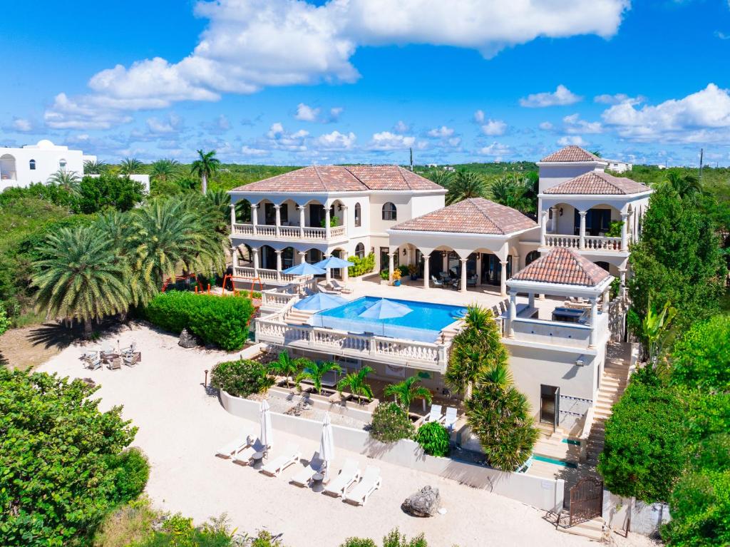 an aerial view of a mansion with a swimming pool at Sandcastle Villa in Crocus Hill