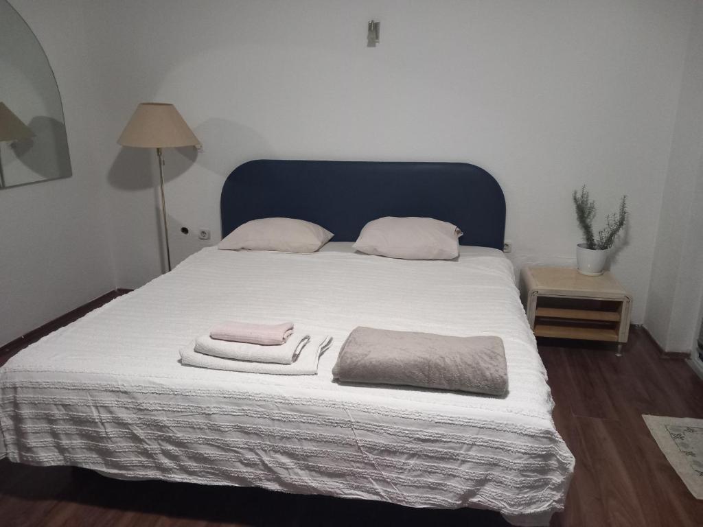 a bedroom with a bed with towels on it at Sokak in Struga