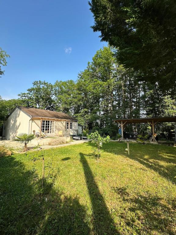 a house in the middle of a grass field at Chill & Nature in Nargis