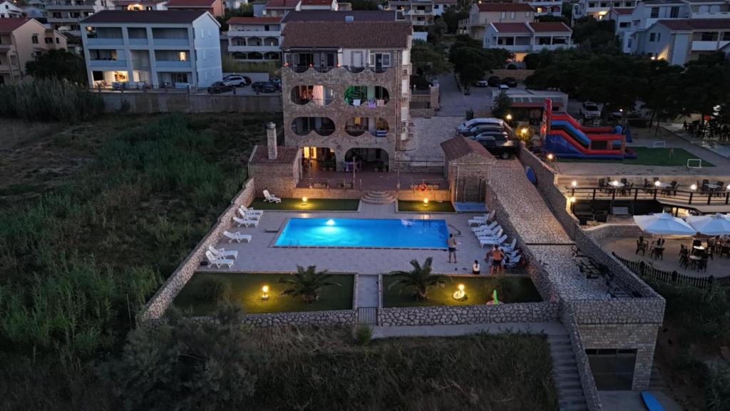 an aerial view of a house with a swimming pool at Pool Apartment Galeb in Pag