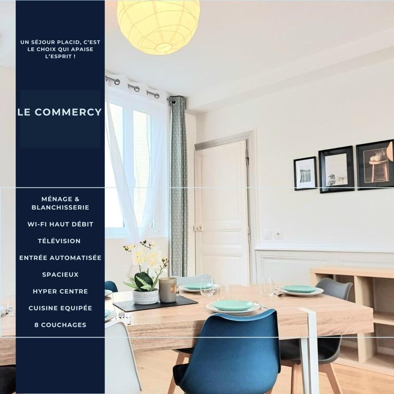 a dining room with a table and blue chairs at Le Commercy - En Hyper Centre Et Très Spacieux in Beauvais