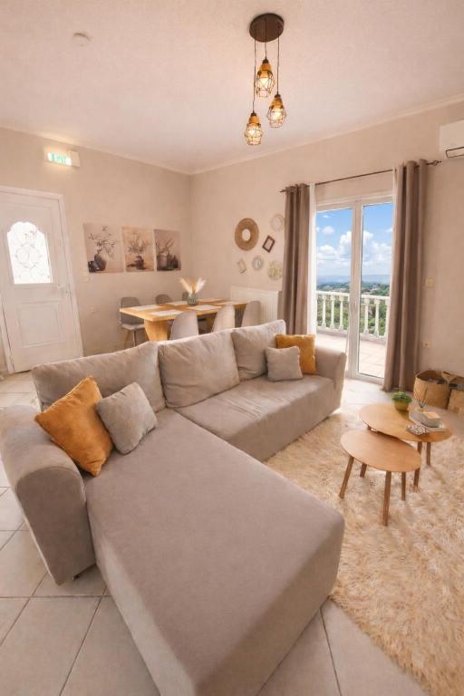 a living room with a couch and a table at Konitsa Horizon Villa in Konitsa