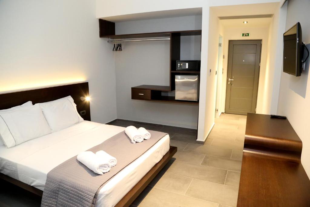 Postel nebo postele na pokoji v ubytování Megara Hotel