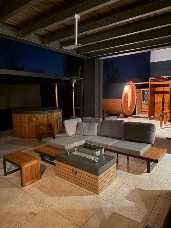 a living room with a couch and a table at Wellness Oase in Paderborn