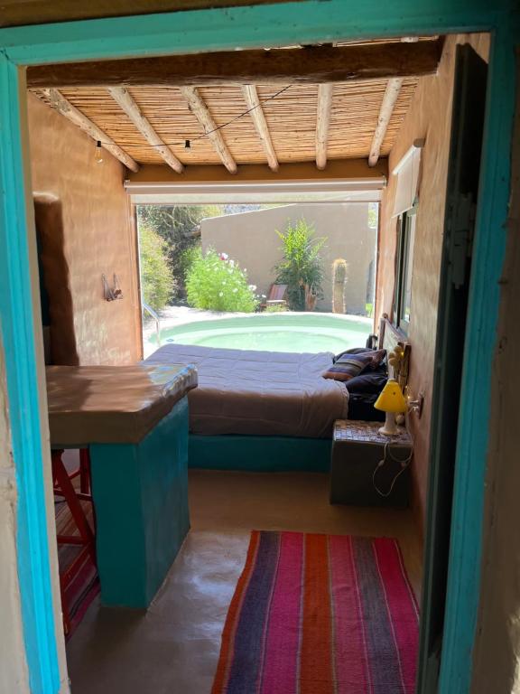 a bedroom with a bed and a large window at Casa Domo Juella in Juella