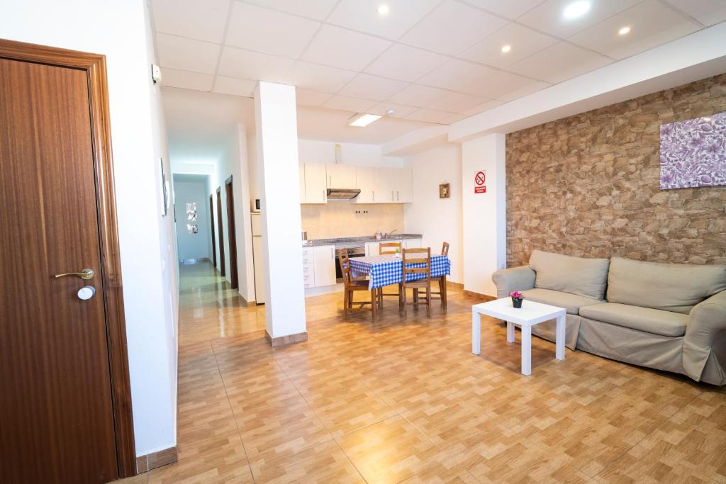 a living room with a couch and a table at Edificio Prieto VIV 2B in Puerto del Rosario