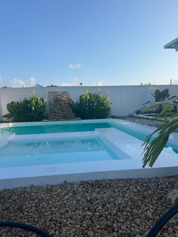 a pool in the backyard of a house at Jamaica House in Nungwi