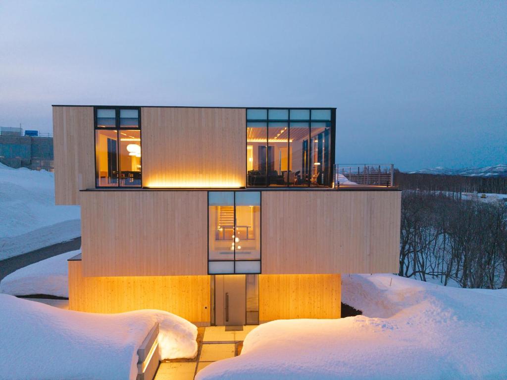 a house in the winter with snow on the ground at Villa Mori - Odin Hills in Kutchan