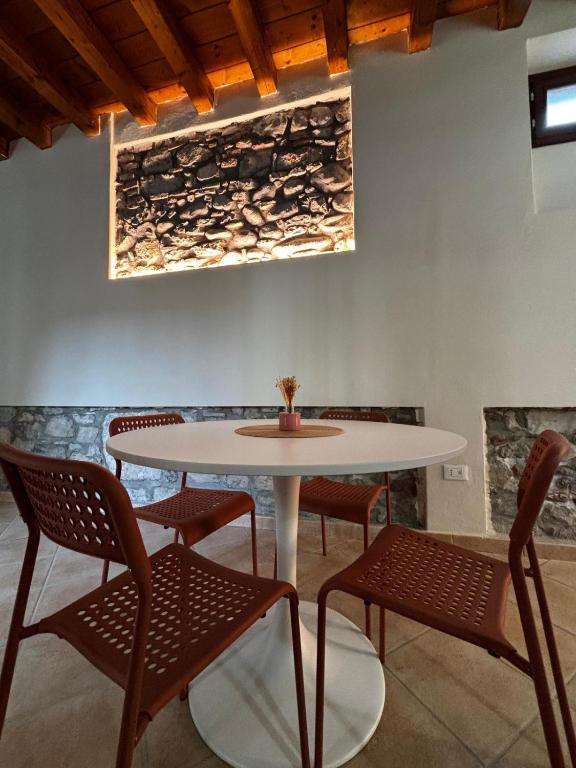 a dining room with a table and chairs at Vittoria in Brescia