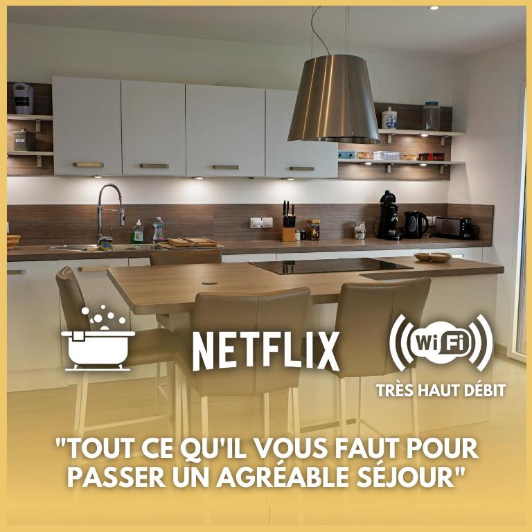 an image of a kitchen with white cabinets at Ty koun-terrasse-2 parkings-6 personnes in Vannes