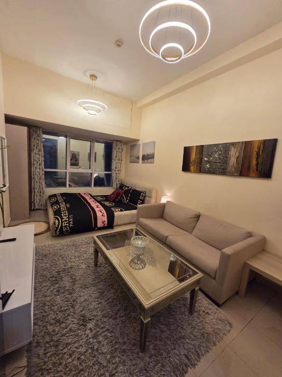 a living room with a couch and a table at Apartment in ajman in Ajman 