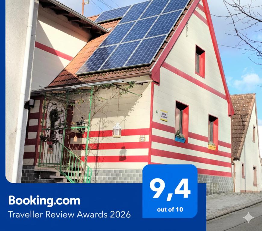 a house with solar panels on the roof at Haus Kunterbunt in Mehlingen