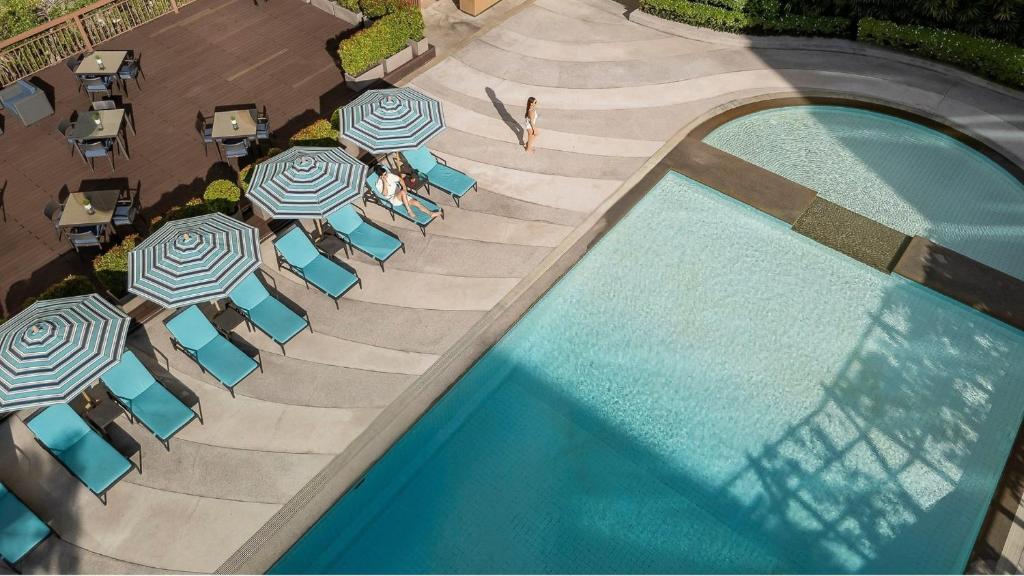 An overhead view of the pool deck and adjoining smaller pool section.