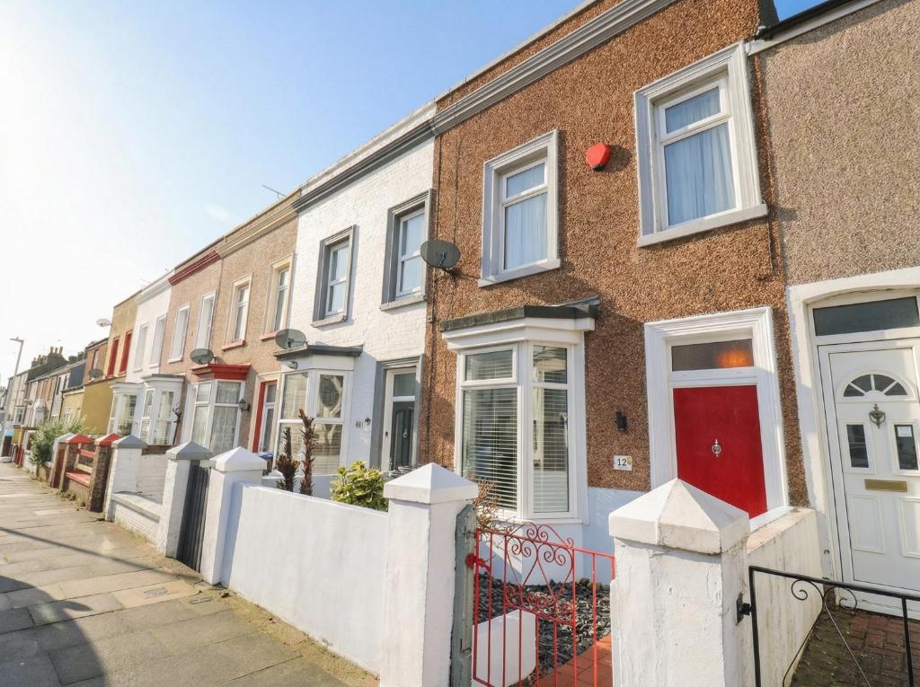 a row of houses on a city street at Meregate Cottage in Margate