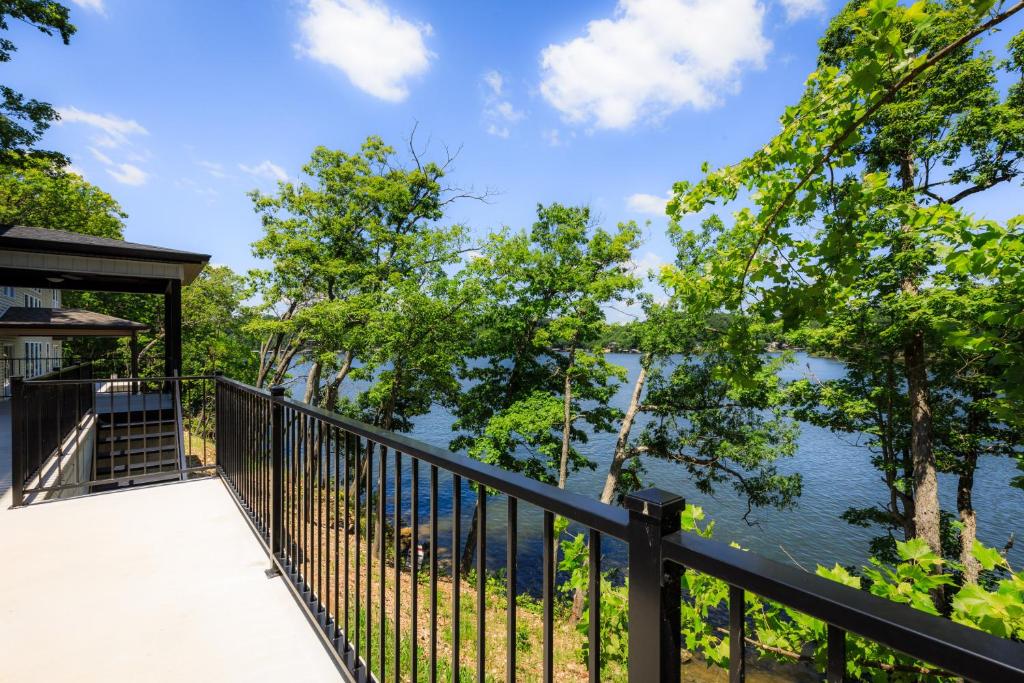 a balcony with a view of the water at Waterfront Retreat One in Rocky Mount