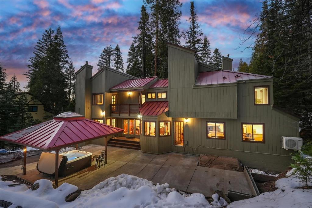 a large house with a purple roof in the snow at Yosemite Spirit in Yosemite West