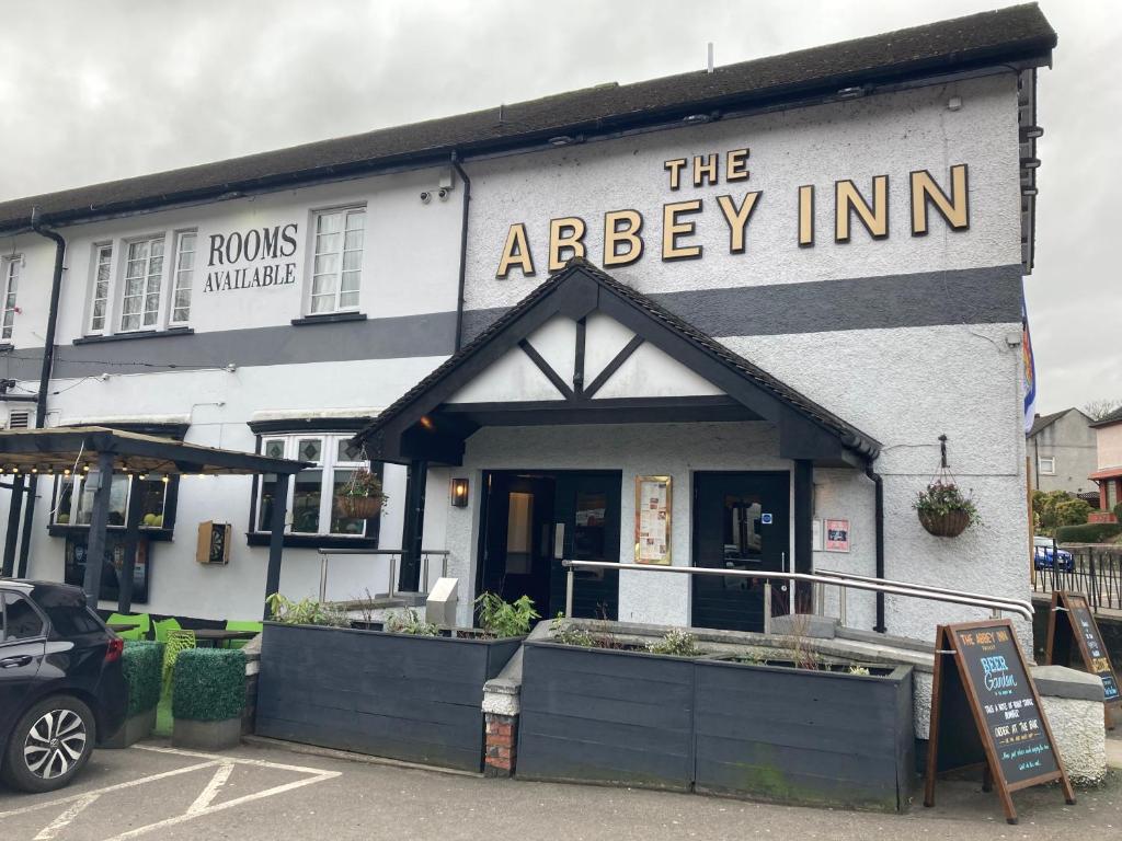 a building with the entrance to the arbey inn at The Abbey Inn in Paisley