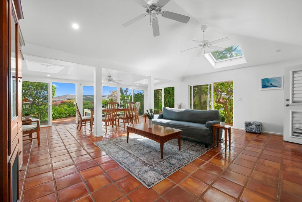 a living room with a couch and a table at Alaeloa 35 in Kapalua