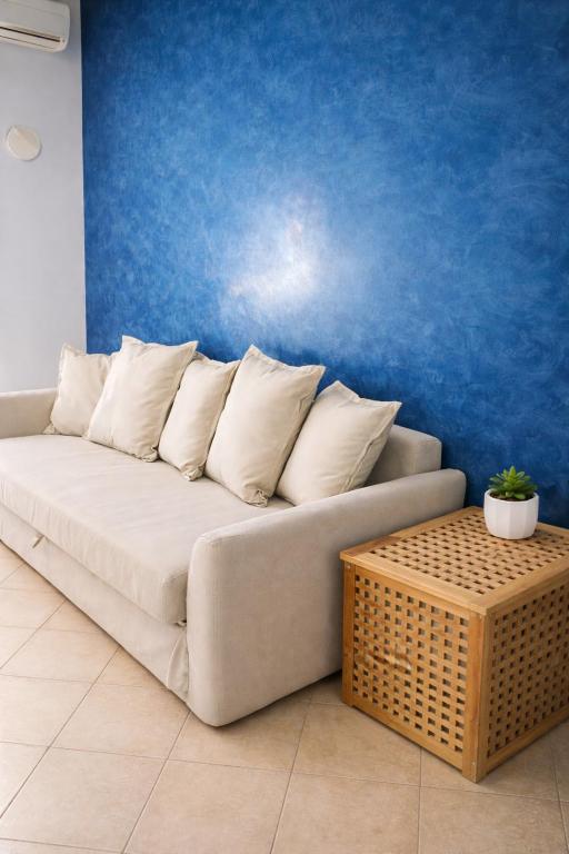a couch with pillows and a table in a room at A Mare in Vasto