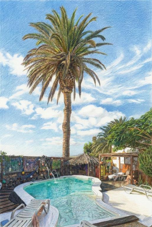 a painting of a palm tree next to a swimming pool at Finca Lucía - Los Hervideros in Mácher