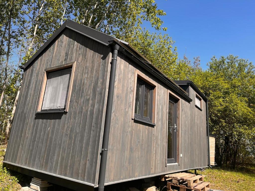 a tiny house on a pile of logs at Tiny House na pevnosti Křelov in Olomouc