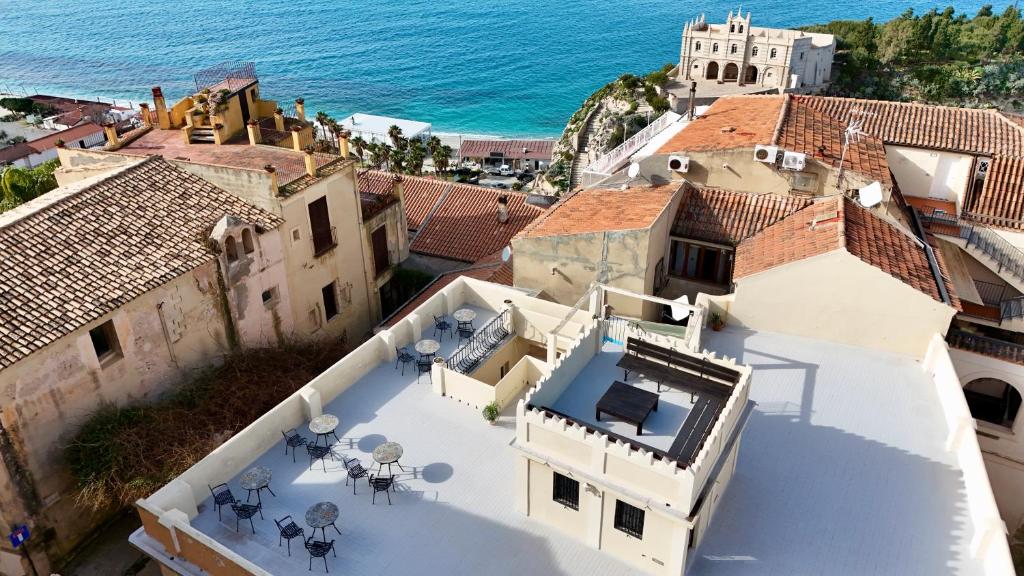 an aerial view of a house with the ocean at Napoleon in Tropea