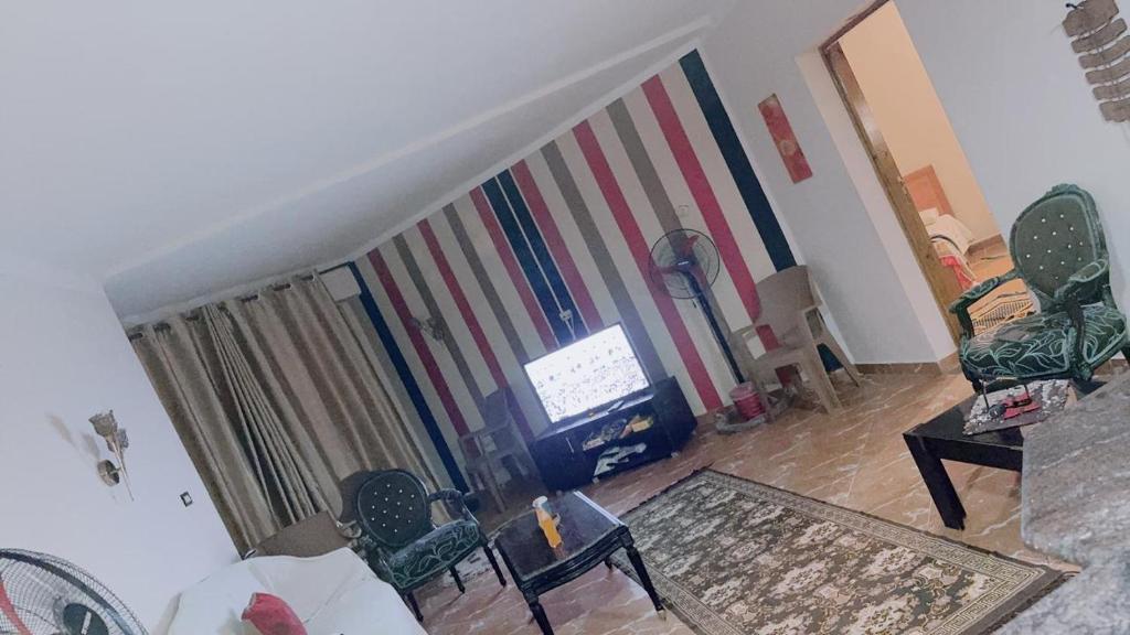 a living room with a flag painted on a wall at باليمرا in Ain Sokhna