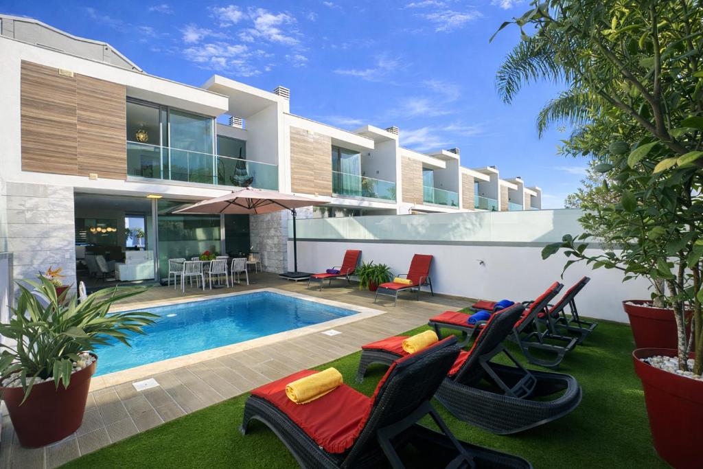 an image of a house with a swimming pool at Lua - Private Pool - 8 Guests - Albufeira in Albufeira