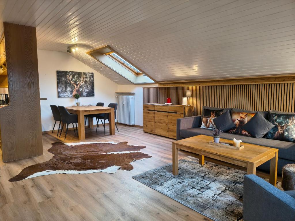 a living room with a couch and a table at Ferienwohnung Allgäu-Hilaria in Fischen
