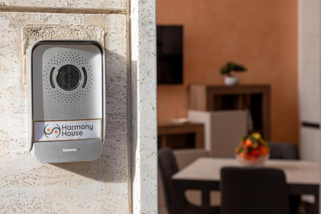 a security camera on a wall in a room at Harmony House in Castellana Grotte