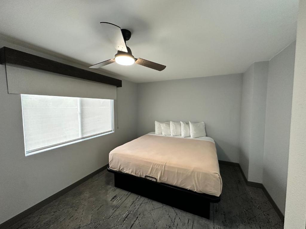 a bedroom with a bed and a ceiling fan at Ponderosa Lodge Ascend Collection in Red River