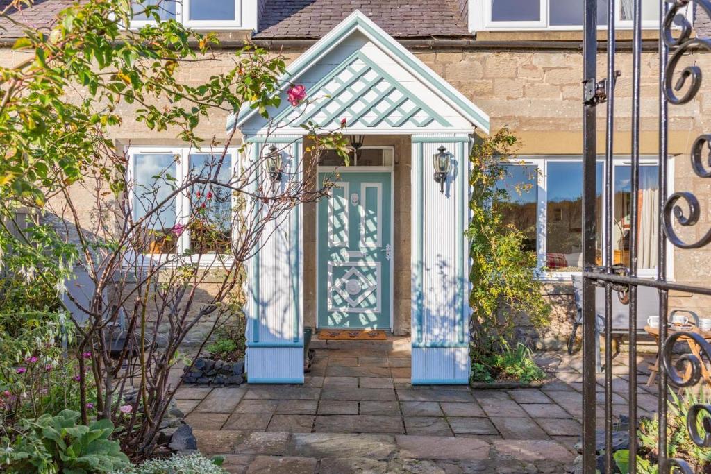 a house with a blue door with a window at 2 Bed in Duns oc-c34024 in Duns