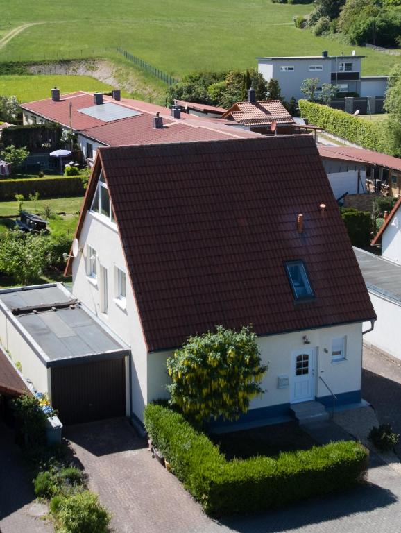 an aerial view of a white house with a brown roof at Ferienhaus Sonnenblick Wernigerode in Wernigerode