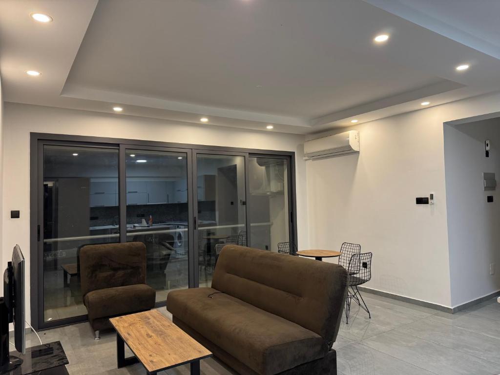 a living room with a couch and a table at 3 bed flat in Nicosia in Nicosia
