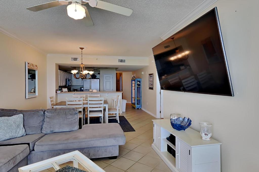 a living room with a couch and a table at Summerwinds #1203 in Navarre