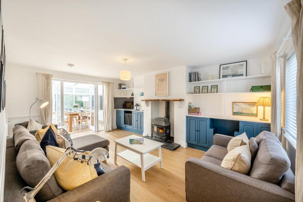 a living room with two couches and a fireplace at 3 Bed in Croyde oc-s34664 in Croyde
