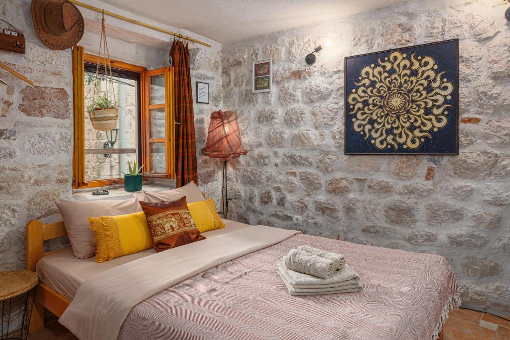 a bedroom with two beds in a room at HealthyStudio512 Apartments in Kotor