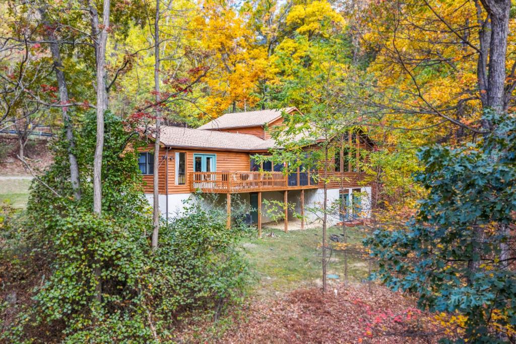 a log cabin in the woods with trees at Healing House - Healing Escape in Berkeley Springs
