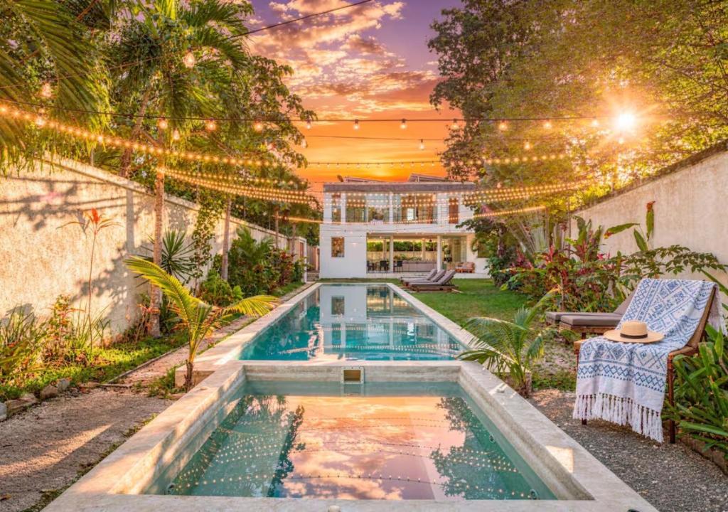 a swimming pool in the backyard of a house at 11BR I Hacienda Zalama in Tulum