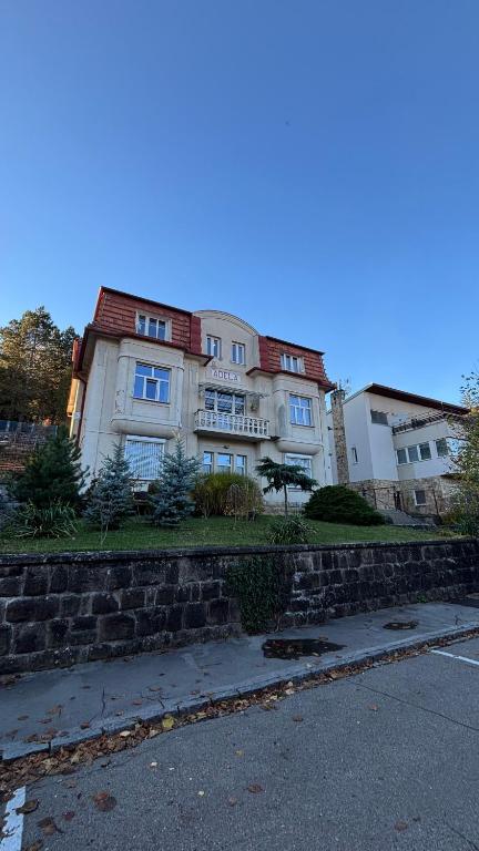 a large building on the side of a street at Špeluňka in Luhačovice