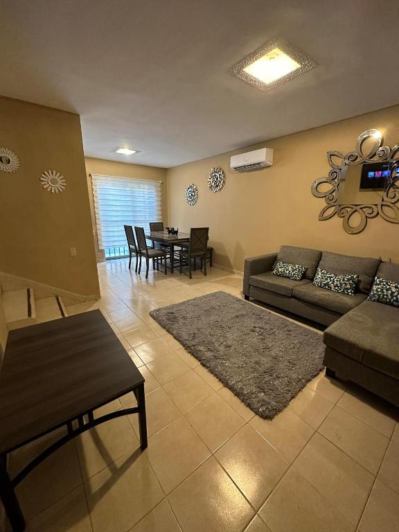 a living room with a couch and a table at Casa Quinta Real in Cedro