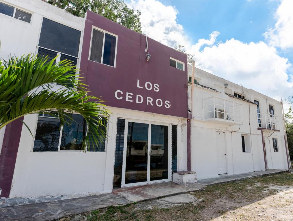 a building with the words los cedros on it at HOTEL LOS CEDROs in Yalsí