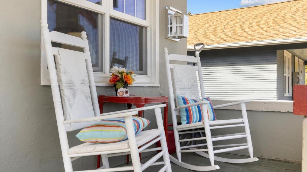 two white chairs and a table on a porch at Alpine Adventure in Red Lodge