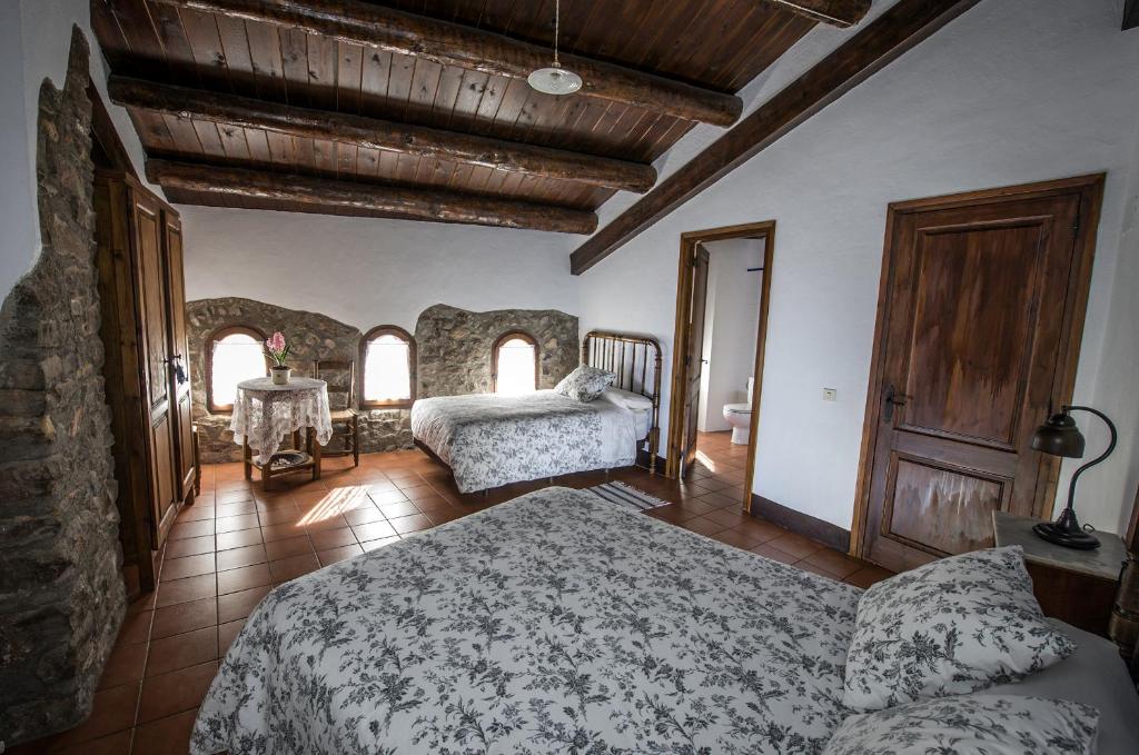 Postel nebo postele na pokoji v ubytování Casa Parramon