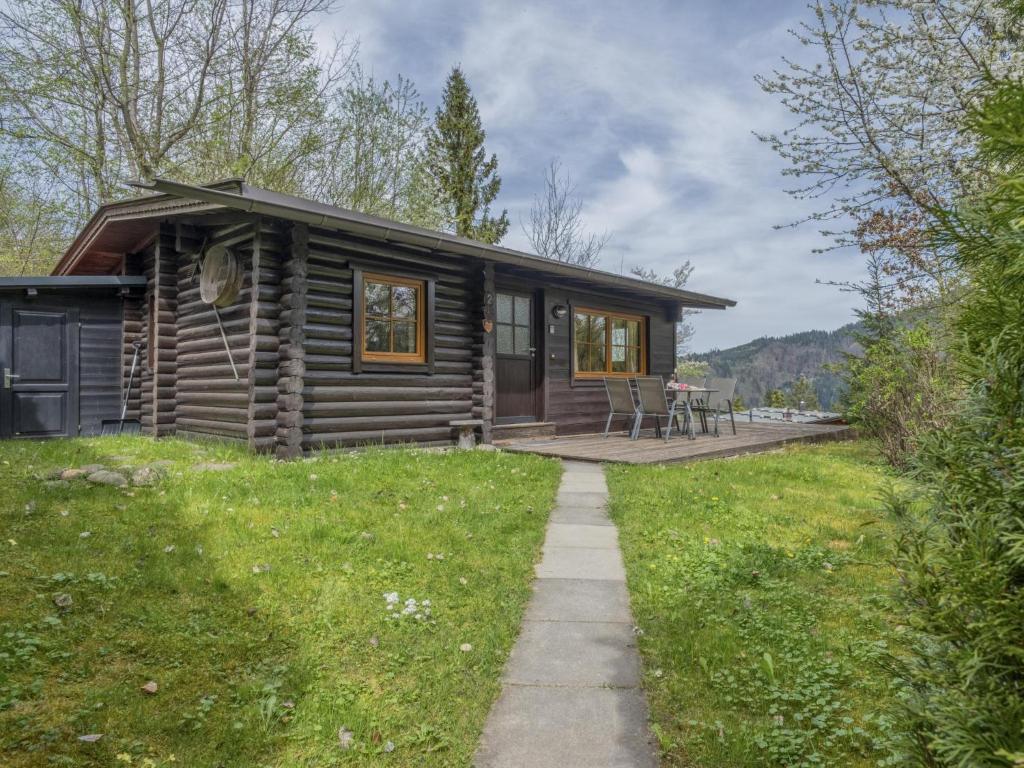 a log cabin with a porch and a patio at im Brixental II in Wörgl