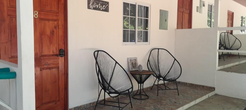 two chairs and a table in a room at EL sunzal Bliss #8 in El Sunzal